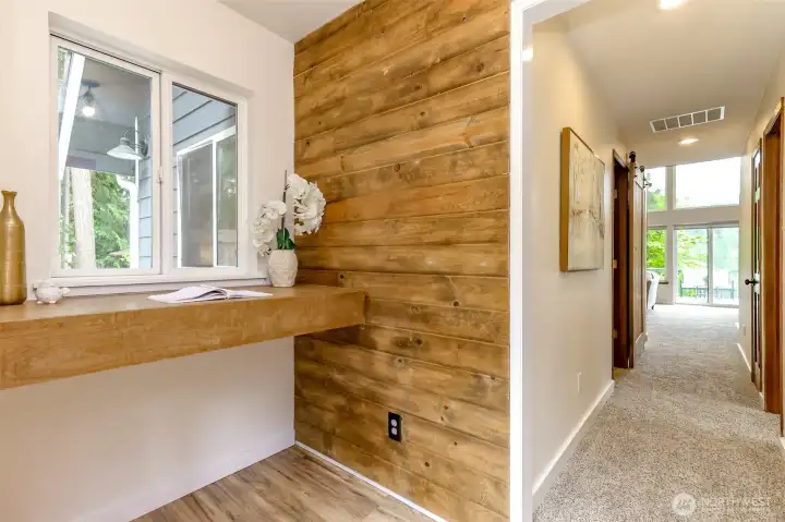 Cute entry with counter shelf and area for bench and shoe storage on the opposite side.