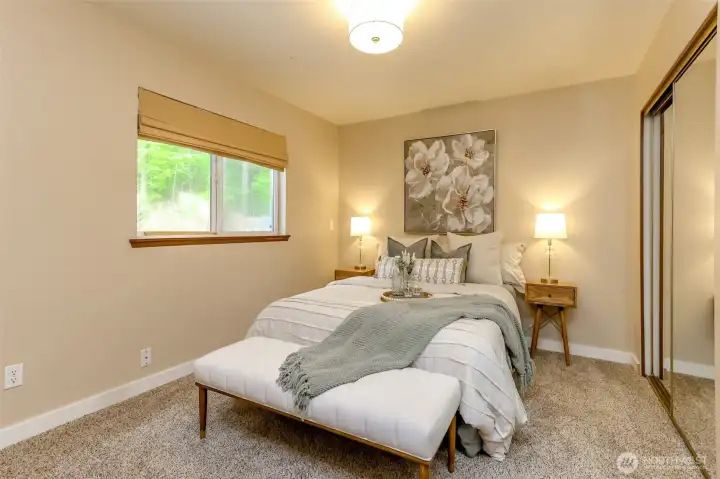 Primary bedroom off front entry with full bathroom just across the hall. Two full length closets.