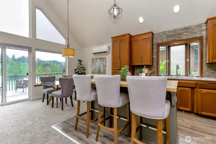 Another angle of the kitchen and the natural light from the windows showcases the light and bright living space.