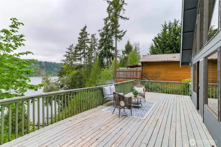 Full length deck with amazing view of the lake. Perfect space for entertaining and enjoying the beauty of Ohop lake and the PNW.