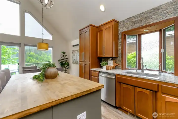 Another angle of this updated kitchen with granite counter tops.