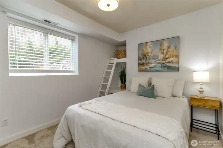 Downstairs bedroom with built in shelves and full closet.
