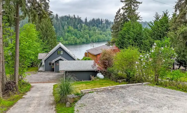 Lots of parking options here from parking pad at the top of the driveway, garage and small spot next to the garage and in gravel.