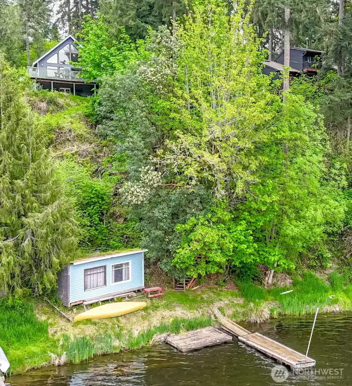 This aerial view shows the boathouse and dock.