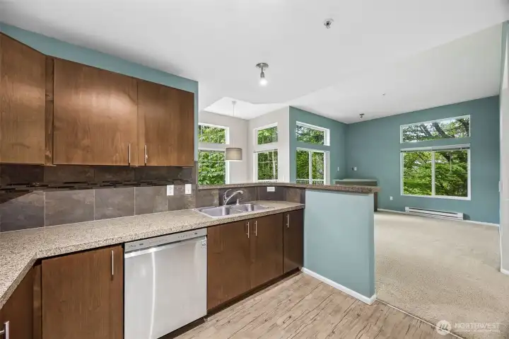 Open-concept layout connecting the kitchen, dining, and living spaces seamlessly.