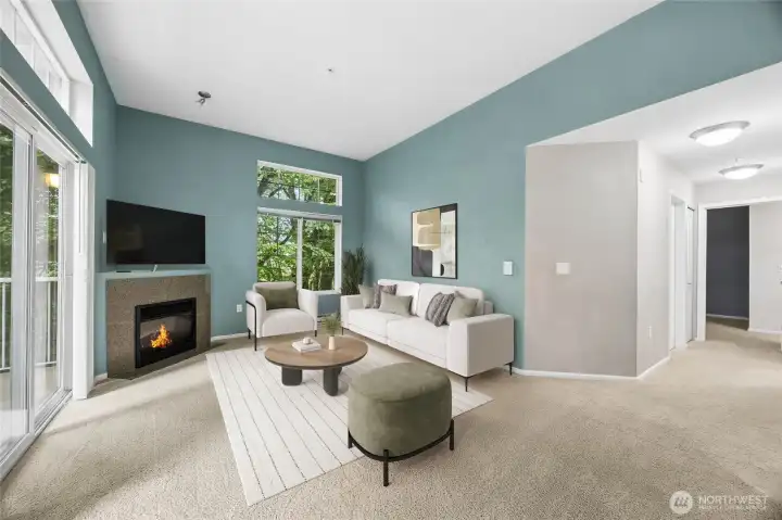 Warm and inviting living room featuring a cozy fireplace and abundant natural light throughout.
