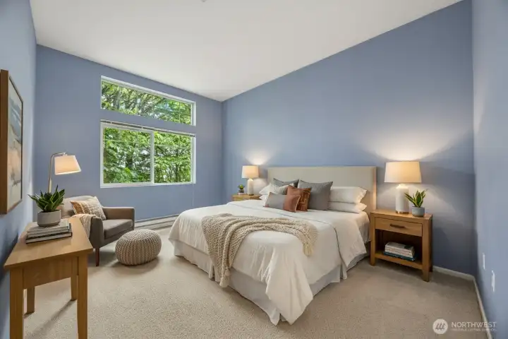 Spacious primary bedroom designed for comfort and relaxation.