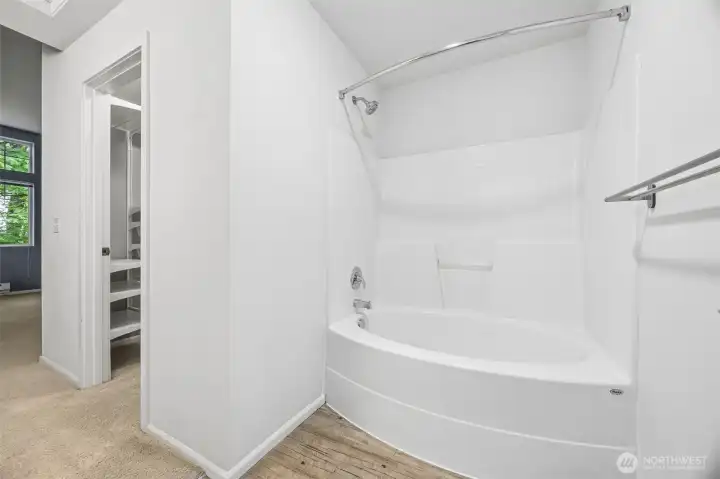 Full primary bathroom perfect for unwinding with a relaxing soak in the tub after a long day.