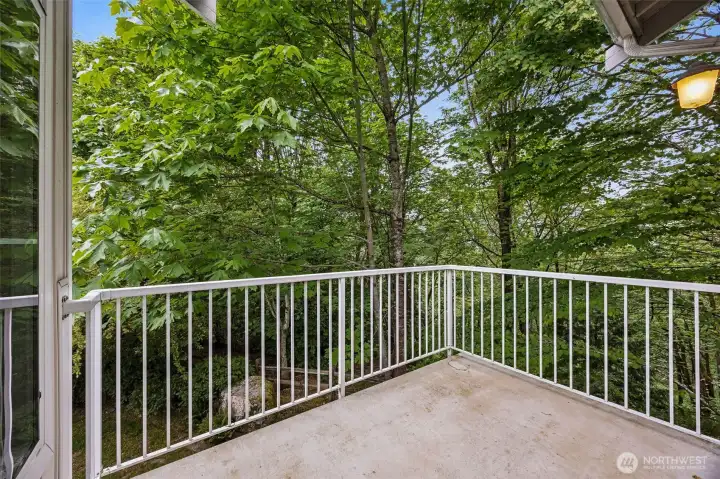 Enjoy your private deck overlooking the peaceful greenbelt.