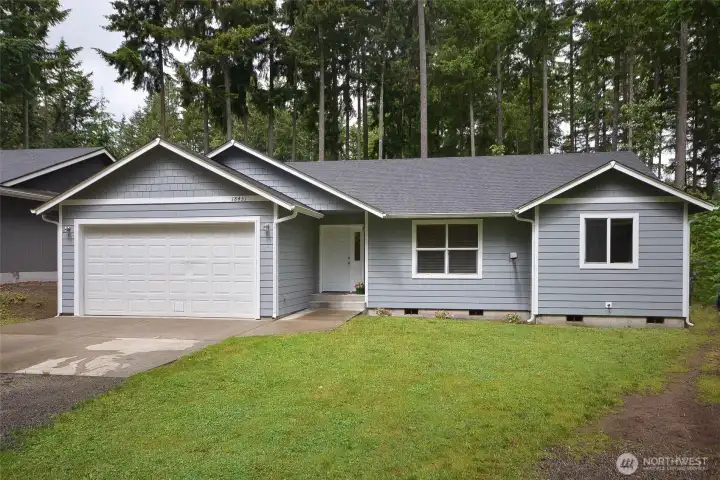 Welcome home to this beautifully updated 3-bedroom, 2-bath rambler offering 1,303 sq ft of comfortable living that feels larger than its footprint. Situated on a generous lot, this inviting home features fresh interior and exterior paint along with stylish laminate LVP flooring throughout.Step into the spacious living room with vaulted ceilings, ceiling fan, and a cozy pellet stove perfect for staying warm during the winter months. The open-concept layout flows into the dining area with sliding glass door leading to the expansive back deck, creating the ideal space for indoor and outdoor entertaining. The kitchen offers a breakfast bar, abundant cabinet storage, and ample counter space for everyday living and hosting guests.The split-bedroom floor plan provides privacy and functionality. The spacious primary suite features a full bath with dual vanities and a walk-in closet, while the additional bedrooms are generously size and located near the full guest bathroom. A laundry room. Welcome home to this beautifully updated 3-bedroom, 2-bath rambler offering 1,303 sq ft of comfortable living that feels larger than its footprint. Situated on a generous lot, this inviting home features fresh interior and exterior paint along with stylish laminate LVP flooring throughout.Step into the spacious living room with vaulted ceilings, ceiling fan, and a cozy pellet stove perfect for staying warm during the winter months. The open-concept layout flows into the dining area with sliding glass door leading to the expansive back deck, creating the ideal space for indoor and outdoor entertaining. The kitchen offers a breakfast bar, abundant cabinet storage, and ample counter space for everyday living and hosting guests.The split-bedroom floor plan provides privacy and functionality. The spacious primary suite features a full bath with dual vanities and a walk-in closet, while the additional bedrooms are generously size and located near the full guest bathroom. A laundry room.