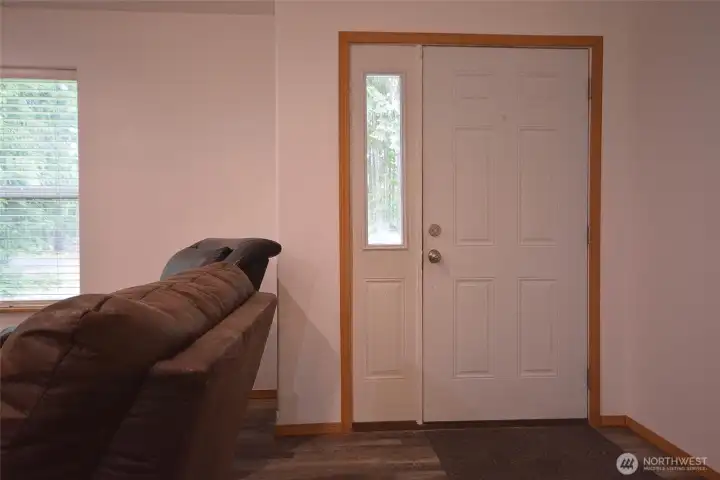 Entry way with coat closet to the right. Entry way with coat closet to the right.