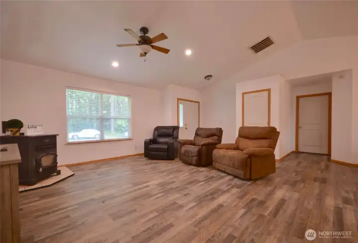 Step into this inviting rambler featuring fresh interior paint throughout, creating a bright and welcoming feel from the moment you enter. The spacious living room is filled with natural Pacific Northwest sunlight through large windows and offers a cozy pellet stove along with a ceiling fan for year-round comfort. Step into this inviting rambler featuring fresh interior paint throughout, creating a bright and welcoming feel from the moment you enter. The spacious living room is filled with natural Pacific Northwest sunlight through large windows and offers a cozy pellet stove along with a ceiling fan for year-round comfort.