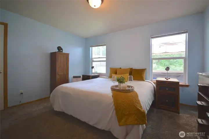 Designed with privacy in mind, this home features a split-bedroom layout. The spacious primary suite is tucked away on one side of the home and offers a relaxing retreat complete with a full ensuite bathroom, double sinks, a shower, and a generous walk-in closet. Designed with privacy in mind, this home features a split-bedroom layout. The spacious primary suite is tucked away on one side of the home and offers a relaxing retreat complete with a full ensuite bathroom, double sinks, a shower, and a generous walk-in closet.