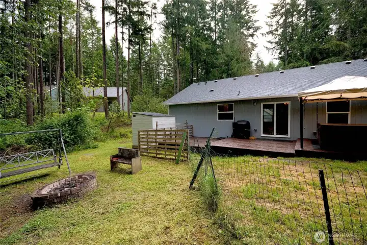 Partially fenced back yard. Partially fenced back yard.