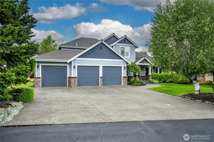 Oversized 3-car garage w/ room for a golf cart.