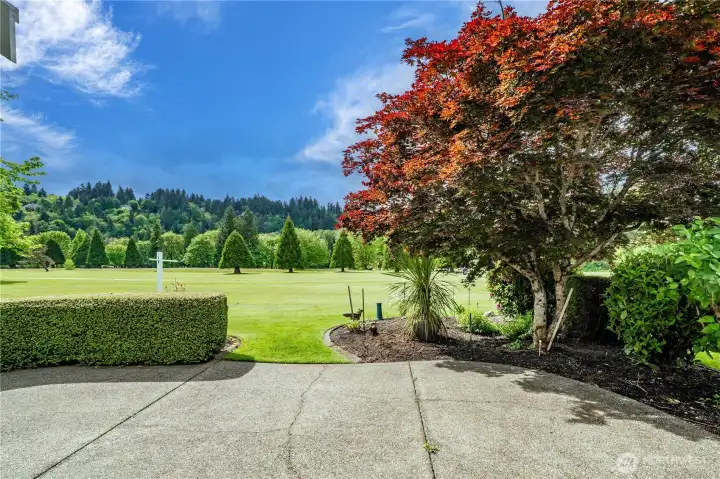 A large back patio positioned on the 10th hole of High Cedars Golf Course.