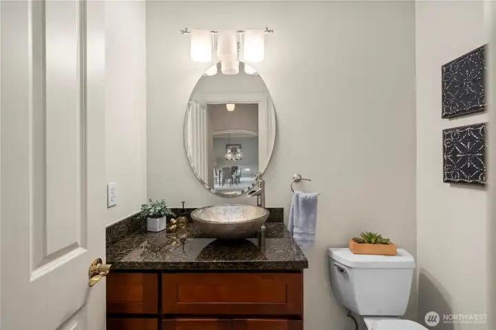Convenient half bath for guests.