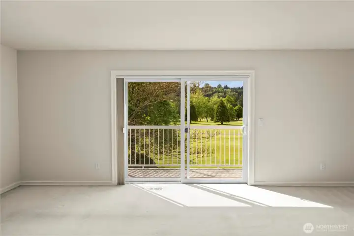 Small deck for enjoying coffee looking out at the golf course from the bonus/family room.