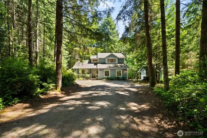 Large driveway easily holds several cars, with a kickout for your RV