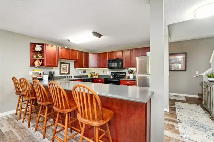 Open kitchen and sitting counter is perfect for entertaining Open kitchen and sitting counter is perfect for entertaining