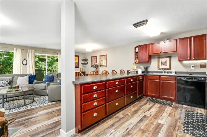 Rich Cherry wood cabinetry, hardwood floors throughout unit and open to spacious Great room. Perfect for entertaining! Rich Cherry wood cabinetry, hardwood floors throughout unit and open to spacious Great room. Perfect for entertaining!