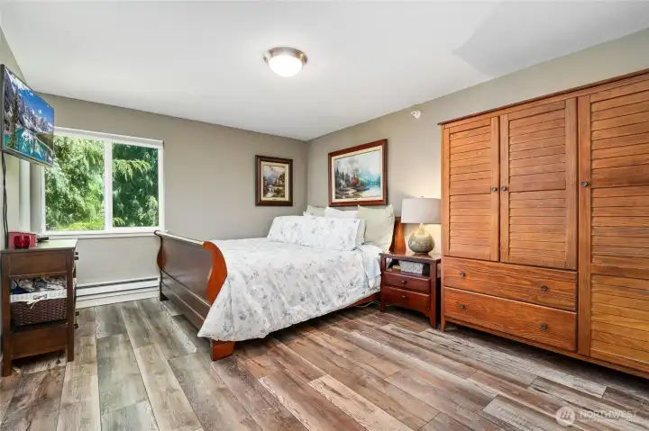 Spacious Master Suite ( King Bed is shown) with hardwood floors. Additional designer armoire on the right is available for purchase Spacious Master Suite ( King Bed is shown) with hardwood floors. Additional designer armoire on the right is available for purchase
