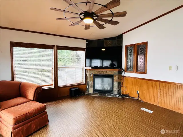 Propane fireplace and large ceiling fan in family room