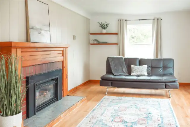 Inviting living room featuring a warm gas fireplace.