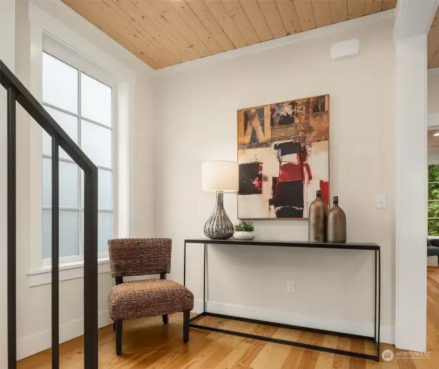 Upstairs at the 2nd level landing, one is greeted by custom milled, solid wood floors, generous, light filled spaces, extensive millwork trim and warm paneled ceilings.  Floors are milled from the wood deconstructed from St. George Episcopal Church, which stood previously on the property since 1959.