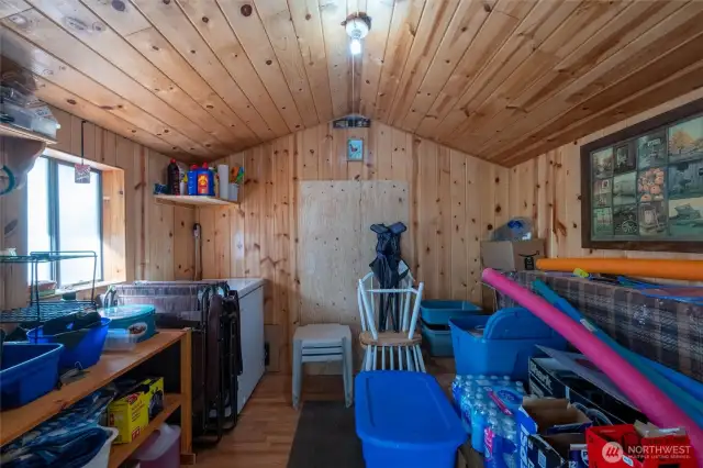 This shed has a bed built in.  Freezer stays as well.