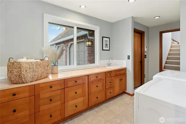 Ample counter for folding laundry and look at all of those storage drawers!