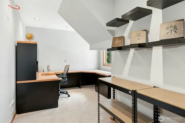The finished bonus office space, accessible from the garage, includes its own heating and a window with serene views of the backyard—ideal for working from home or creative pursuits