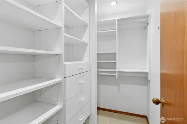 Primary bedroom walk-in closet