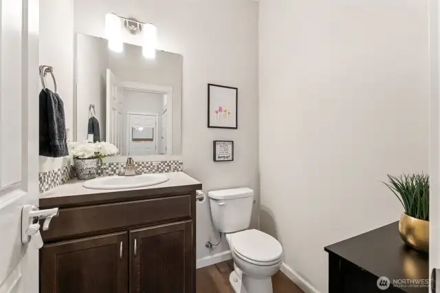 First floor powder room, convenient and not right off the family room and kitchen! Back by the garage entrance.