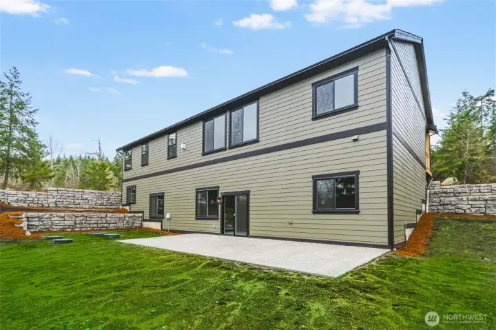 Plenty of level area in rear yard.   Grass enhancement added to photo.