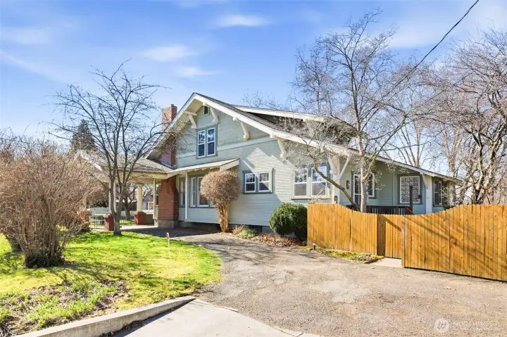 Driveway from Division St connects covered carport and garage