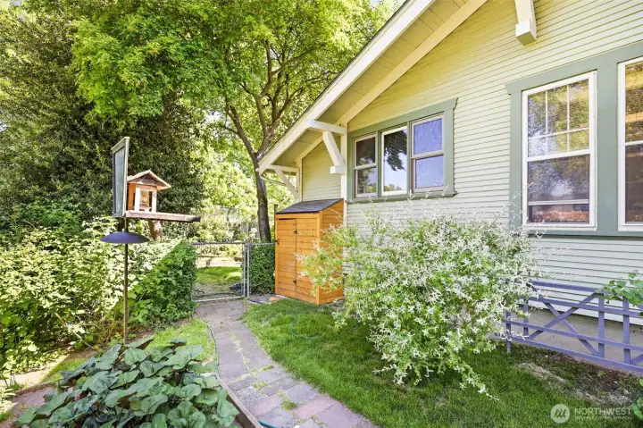 Shed and birdhouse along the side yard