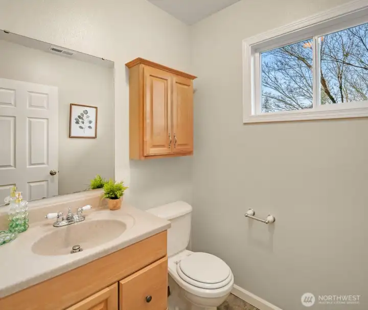 Power room is convenient located right by family room.