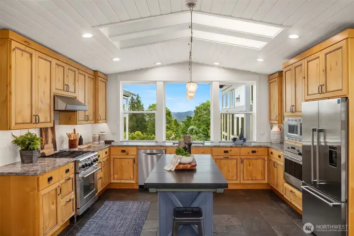 Light and bright kitchen, custom cabinets and island, gas cooktop, two ovens