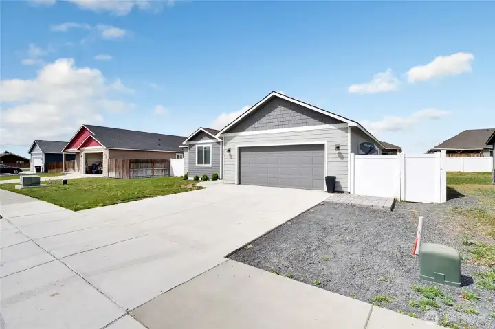 Driveway and front elevation with attached garage and exterior finishes
