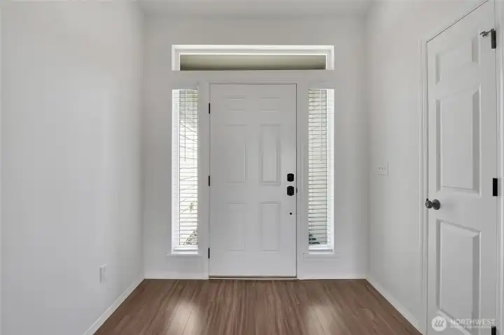 Entry foyer with natural light and access to main living spaces