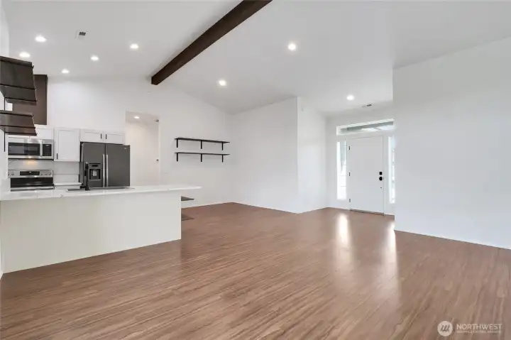 Main living area with open floor plan and kitchen connection