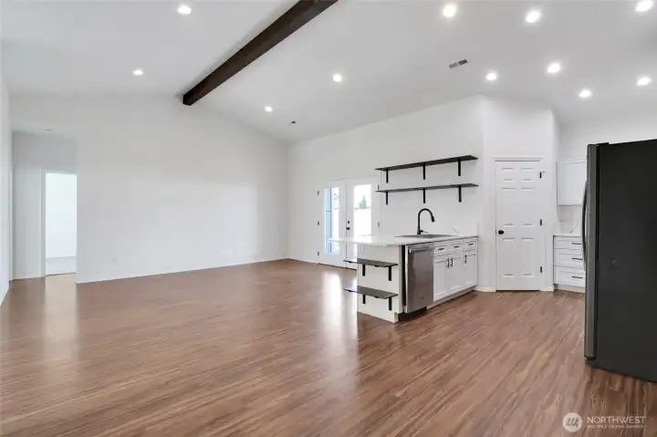 Living space with recessed lighting, open layout, and dining area access