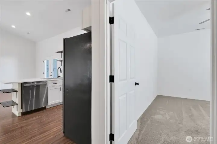 Hallway transition connecting bedroom and main living area
