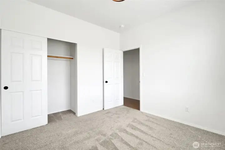 Bedroom with sliding closet doors and functional layout