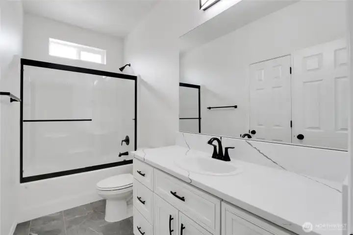 Bathroom vanity with storage and tub/shower combination