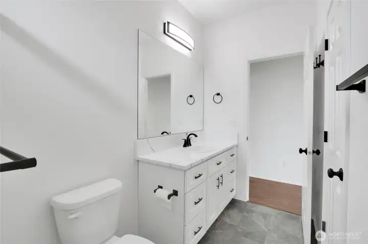 Guest bathroom with vanity storage and updated finishes