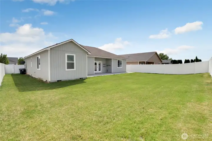 Backyard perspective showing fenced perimeter and outdoor recreation space