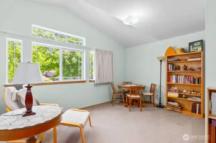 Bedroom number 4 with vaulted ceiling and large windows for great light.
