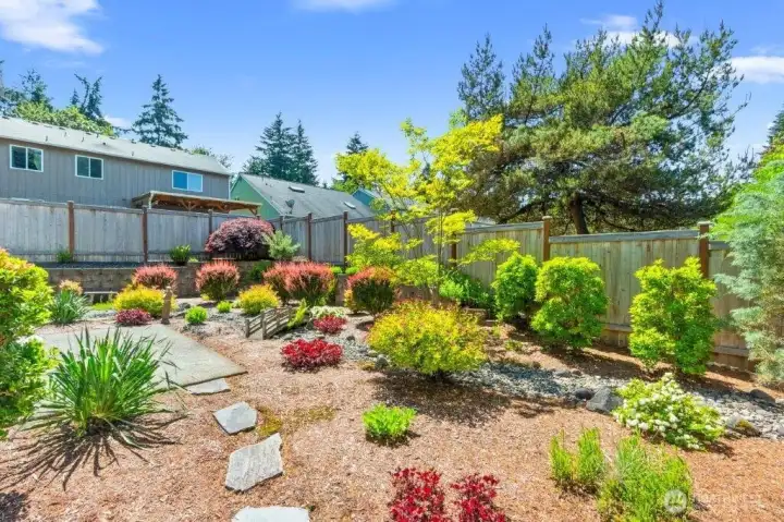 The professionally landscaped and low maintenance backyard.